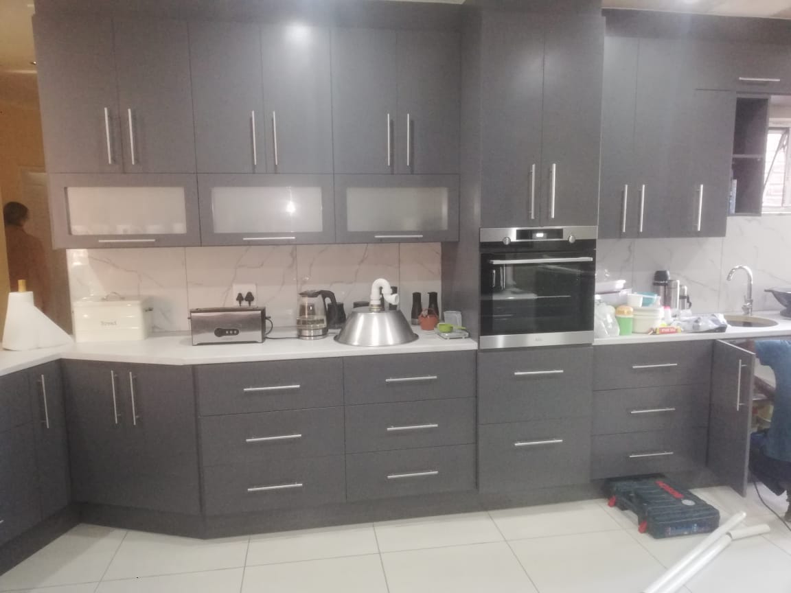 Executive kitchen cabinetry with dark finishes